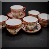 P97. 11-Piece Asian teacup set with saucers. Red and orange tones. - $22 